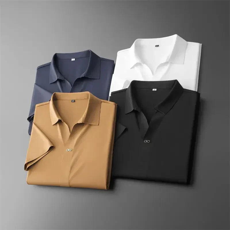 Folded men's polo shirts in white, navy, charcoal, and khaki showcasing available color options.