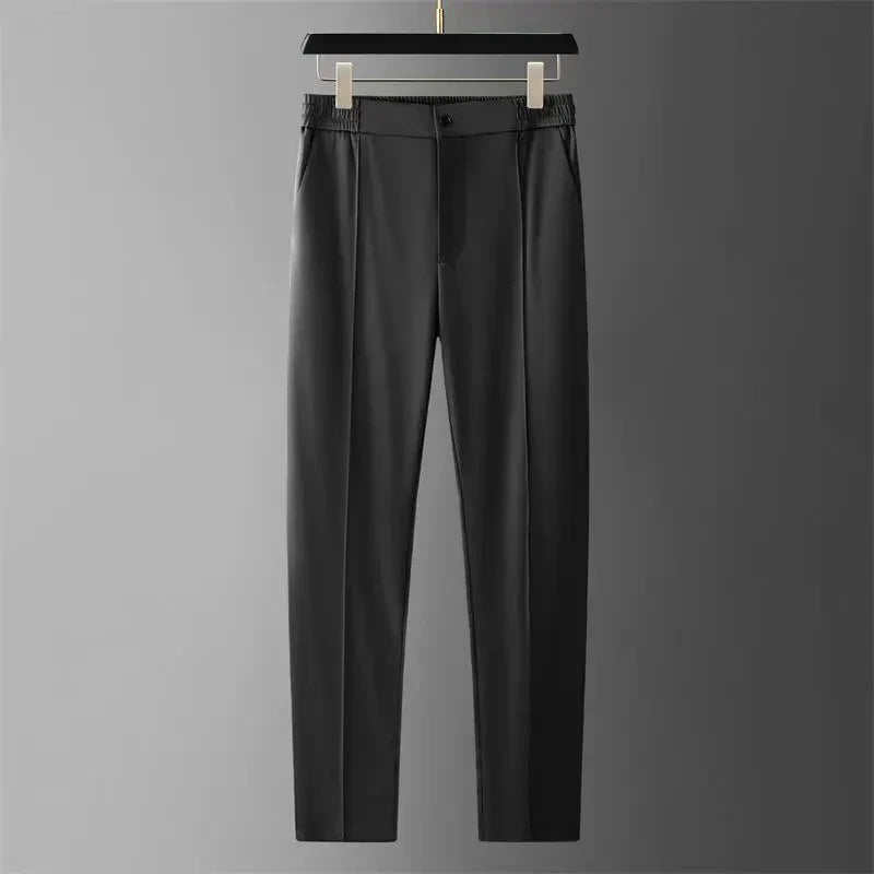 Men's black straight-leg pants with an elastic waistband displayed on a hanger.