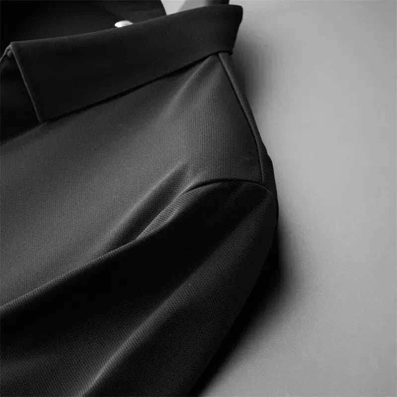 Close-up of smooth black fabric highlighting the lightweight texture and soft drape.