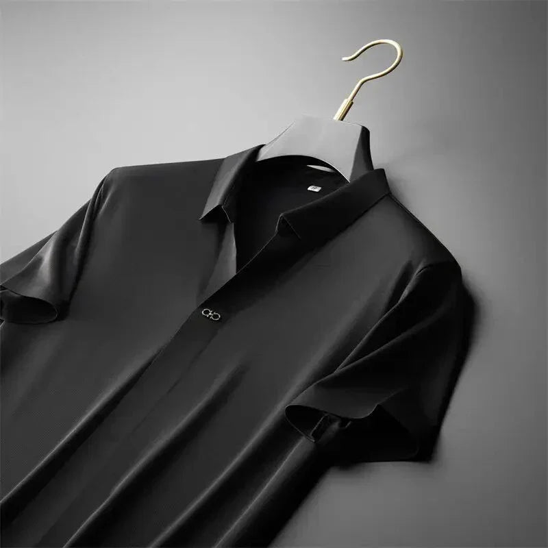 Men's black short-sleeve polo shirt displayed on a wooden hanger with a classic collar.