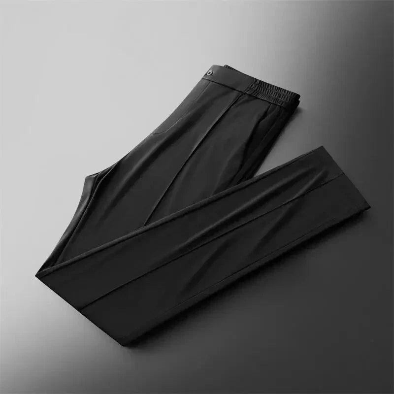 Folded pair of men's black straight-leg pants highlighting the streamlined silhouette.