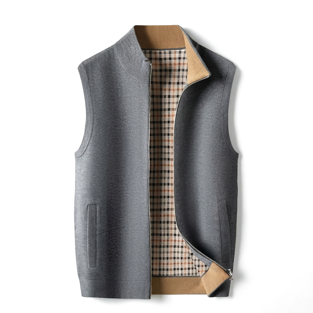 Men's gray knit zip-up sweater vest displayed open, showcasing the stand collar, front zipper, and plaid interior lining.