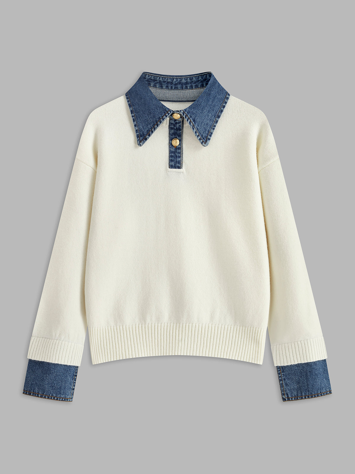 Cream knit sweater featuring a denim shirt collar, denim cuffs, and a relaxed fit displayed on a white background.