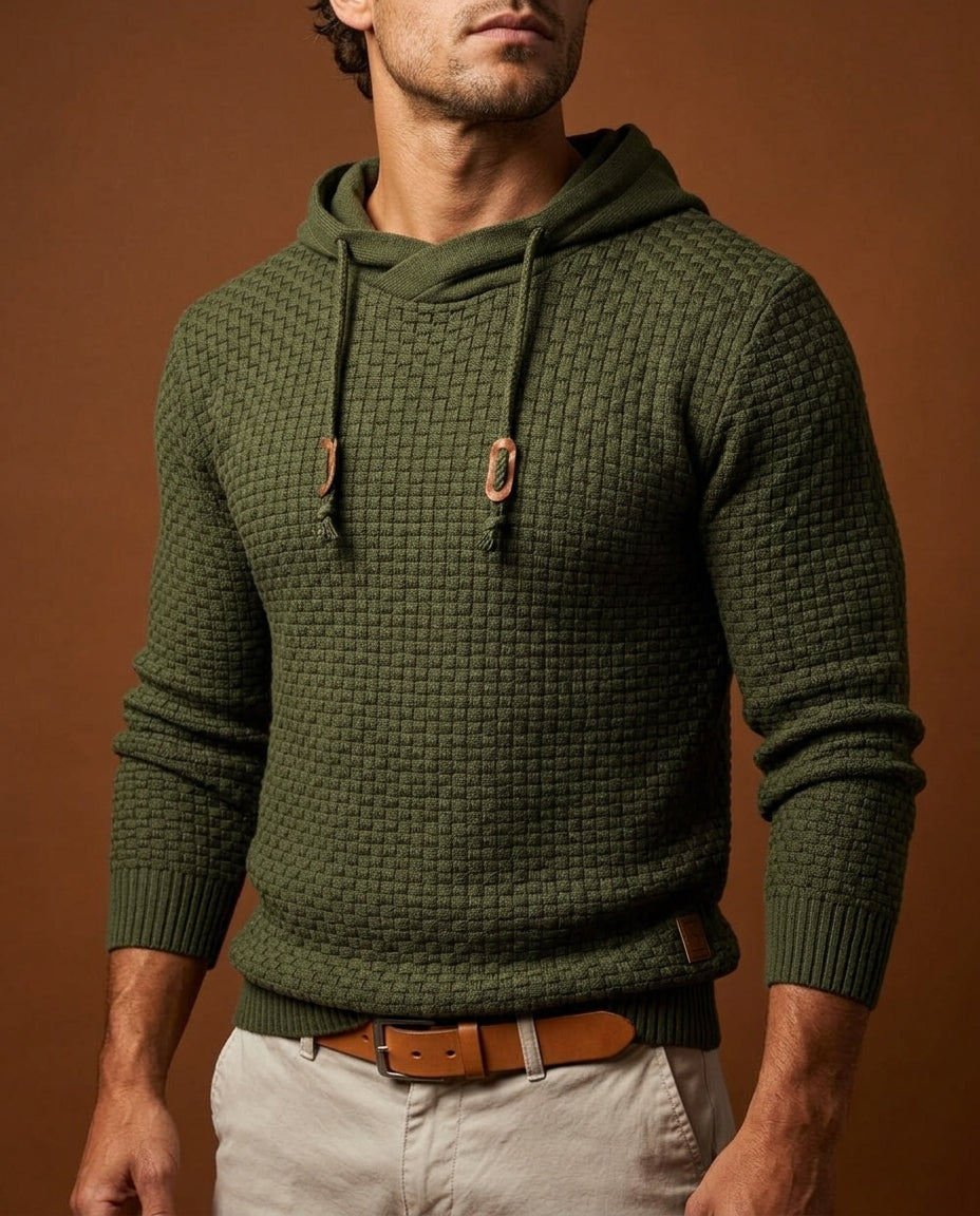 Man wearing olive green textured knit hooded sweater with wooden toggle drawstrings, close-up front view