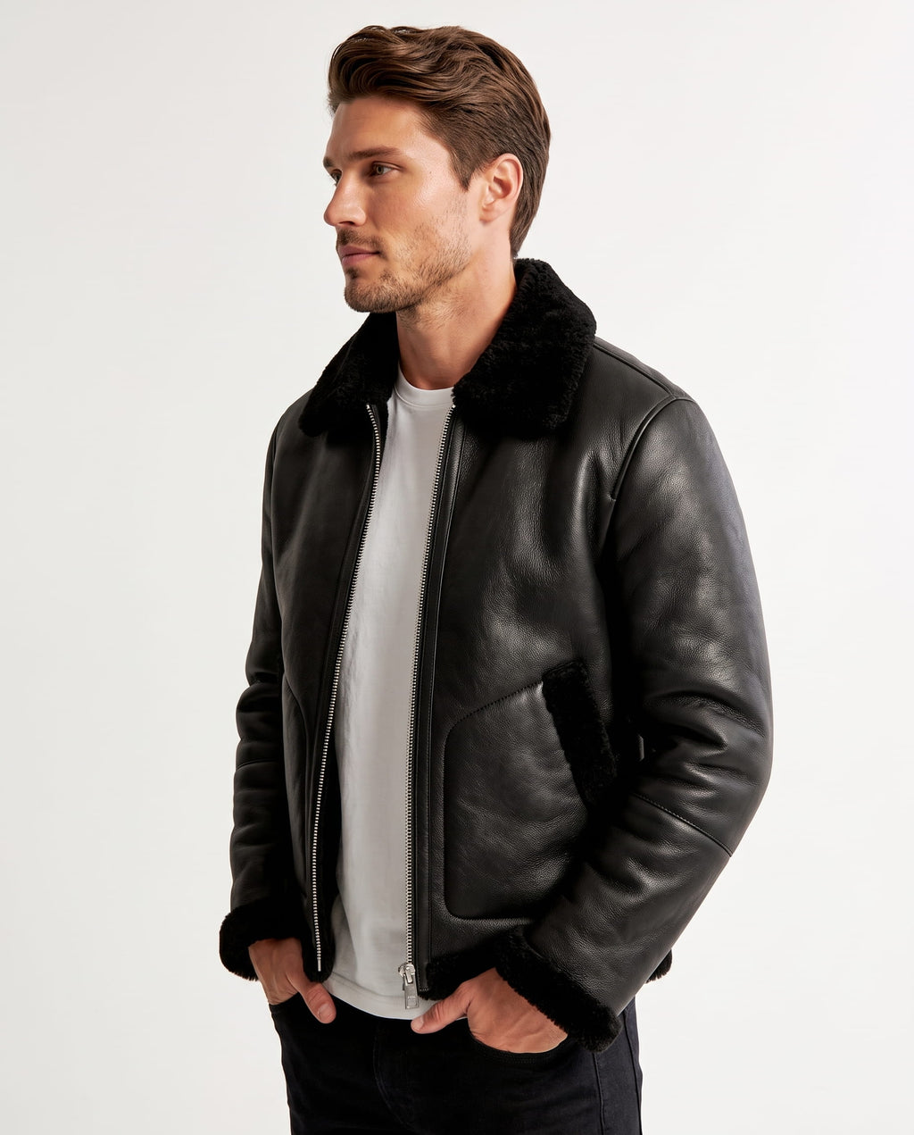 Black leather aviator jacket with plush shearling collar, cuffs, and hem, featuring a full-zip front and angled pockets.