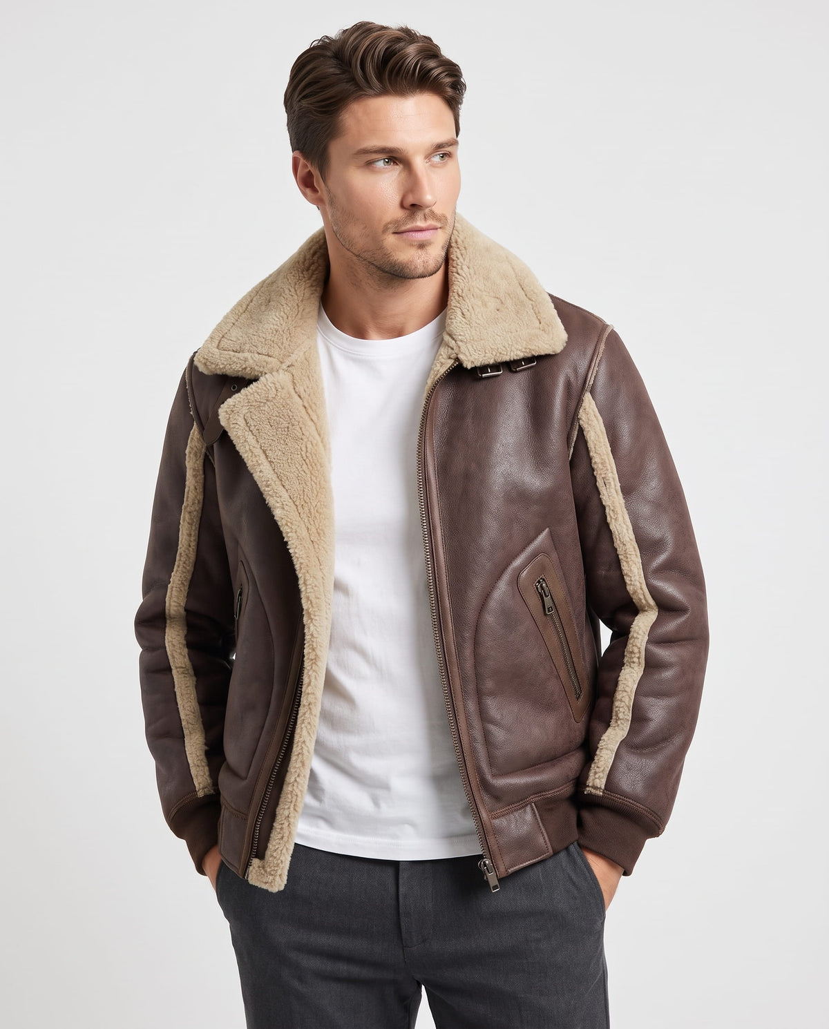 Brown vegan leather aviator jacket with plush sherpa lining, oversized collar, and zip pockets on a man.