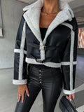 Black vegan leather cropped aviator jacket with white sherpa trim, wide collar, and adjustable waist buckle straps.