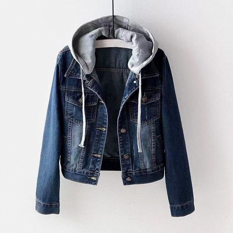 Women's dark wash denim jacket featuring a detachable gray hood, button-front closure, chest pockets, and classic denim styling.