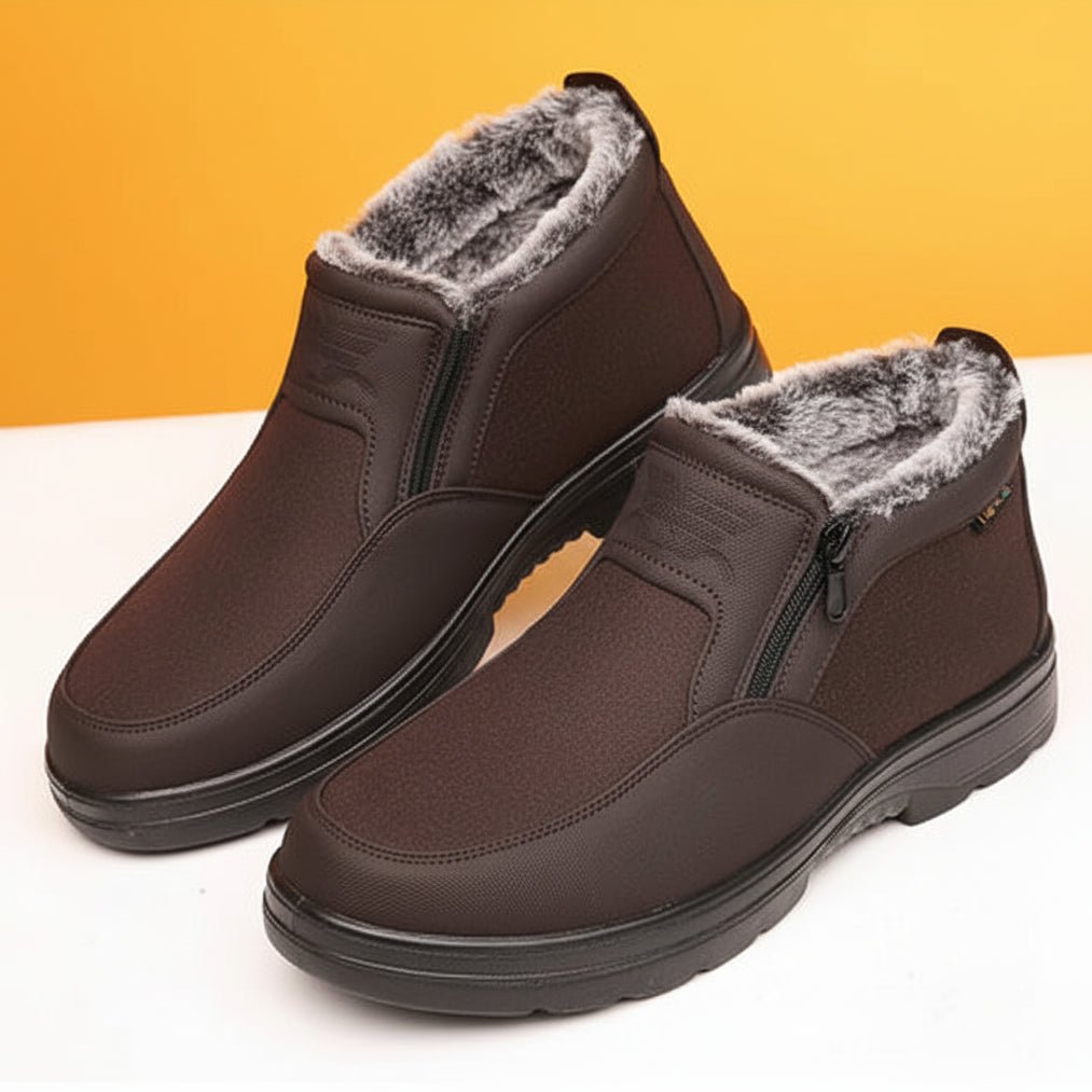 Brown side-zip winter boots for men with fur lining, cushioned insert, and rugged tread, side view