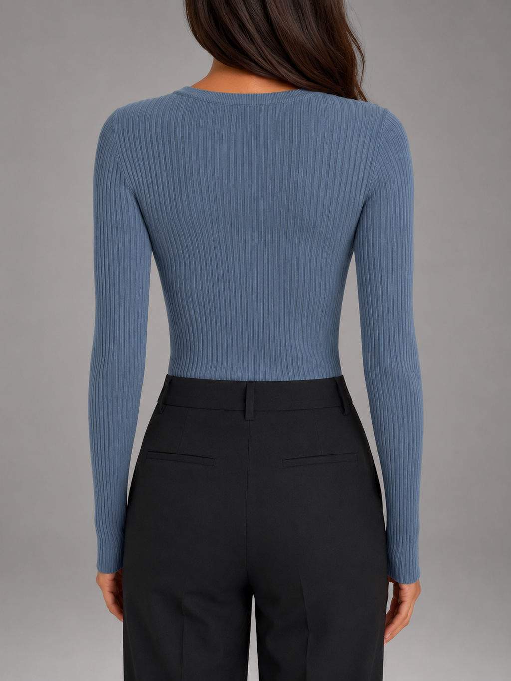 Back view of a women's blue ribbed knit sweater with long sleeves and a fitted silhouette.