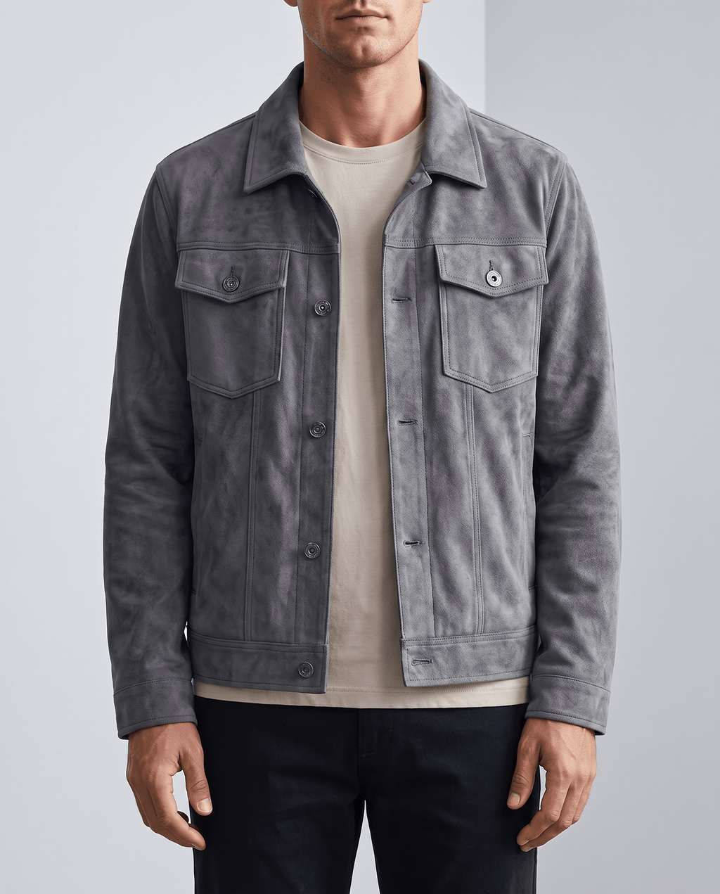 A man wearing a gray soft suede jacket with chest pockets and side pockets
