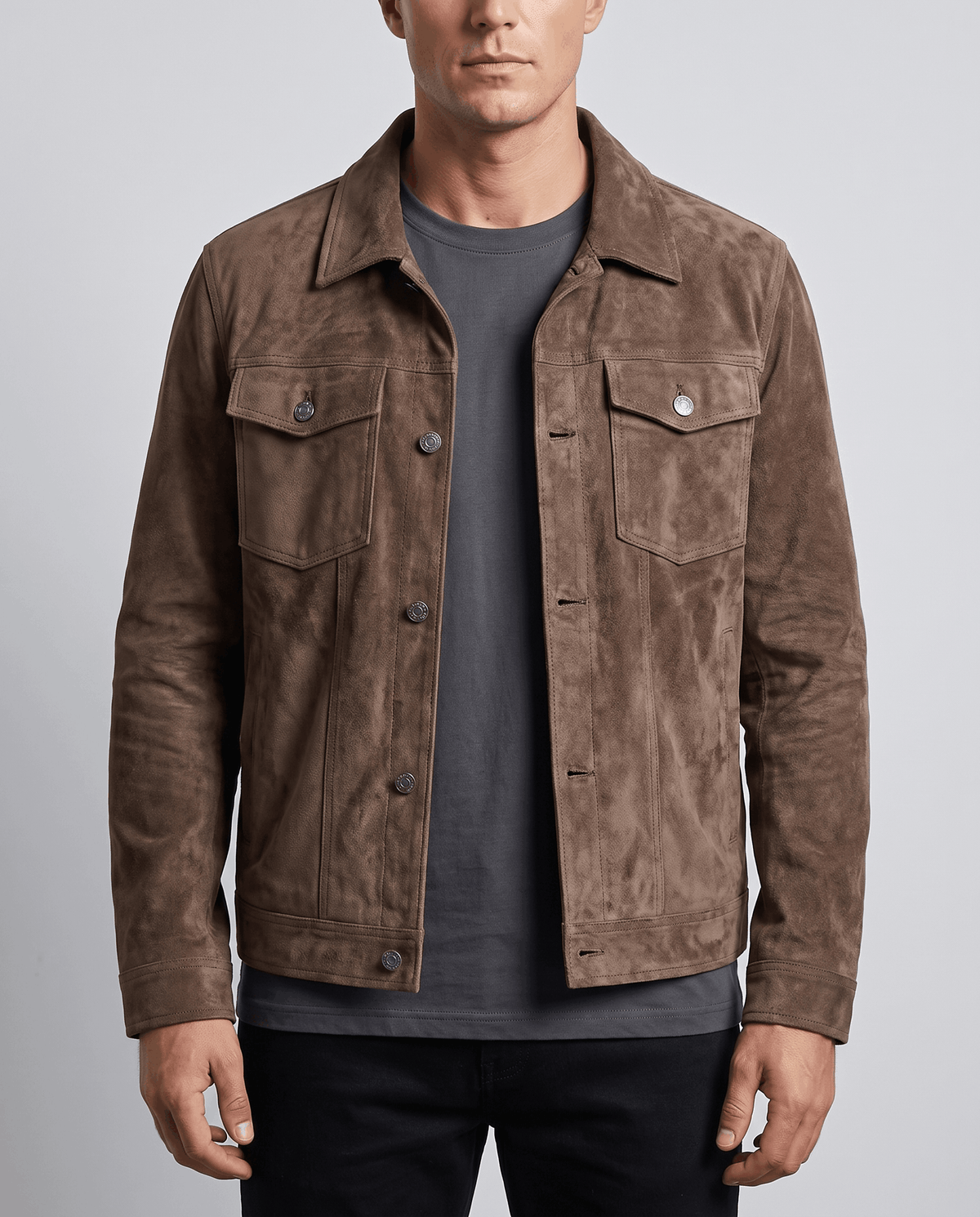 A man wearing a dark brown soft suede jacket with a relaxed fit, chest pockets, and side pockets
