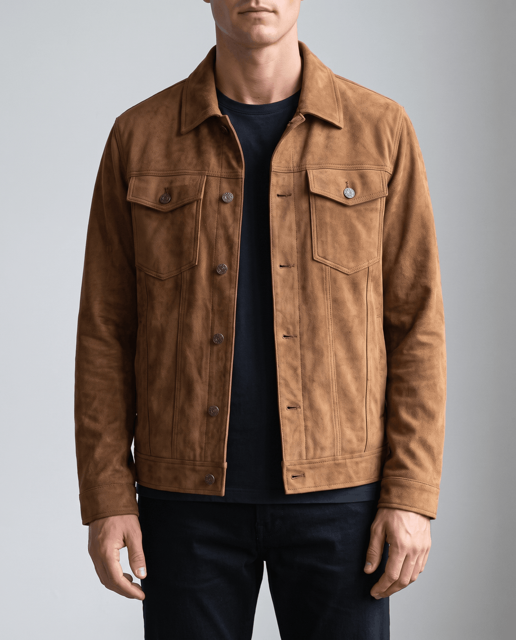 A man wearing a brown soft suede jacket with a relaxed fit, chest pockets, and side pockets