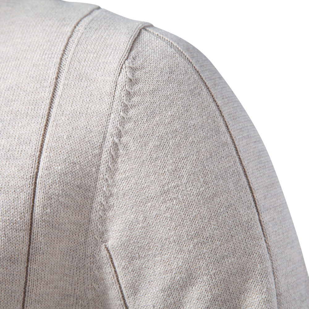 Light gray stretch cotton quarter-zip sweater featuring vertical knit detailing and reinforced shoulder seams.
