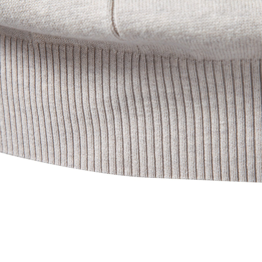Light gray stretch cotton sweater featuring a wide, ribbed hem and subtle vertical knit detailing on the soft fabric.