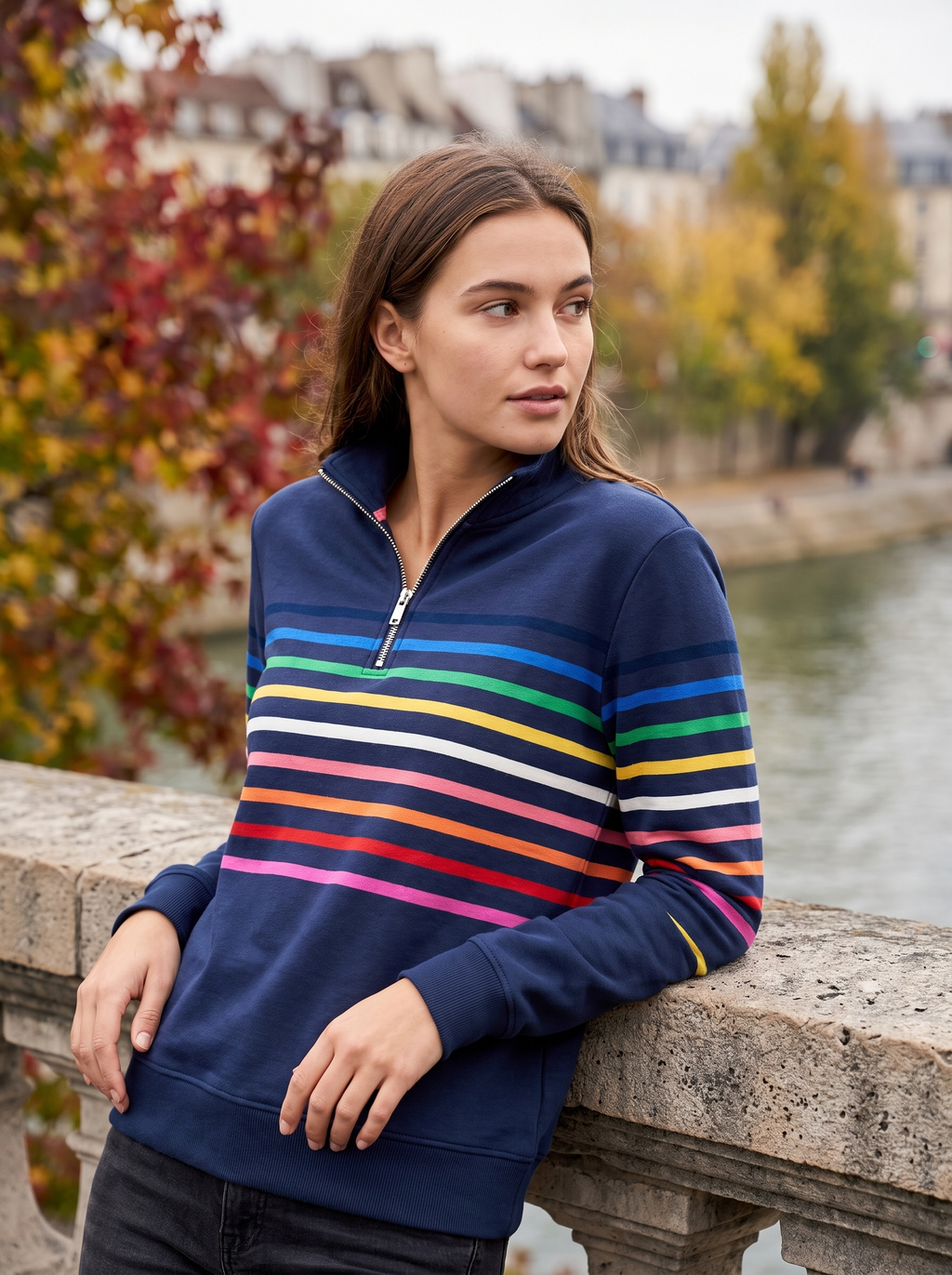 Navy blue half-zip sweatshirt in brushed cotton featuring a vibrant multi-colored striped pattern and a structured stand collar.