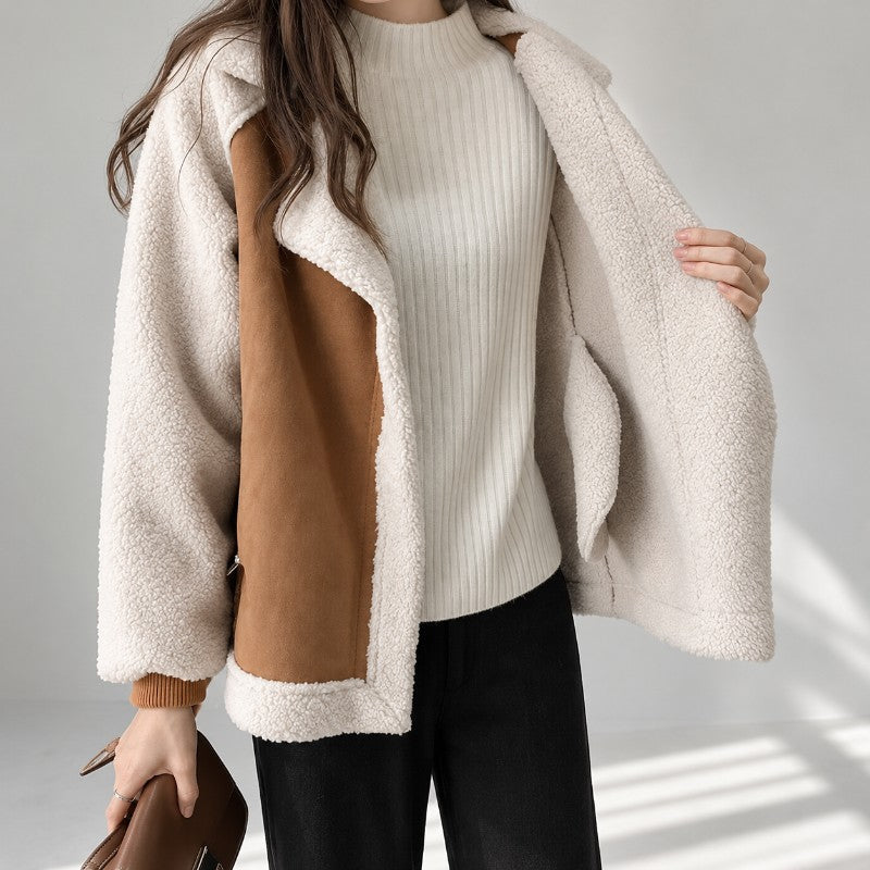 Vegan suede aviator jacket in tan with contrast cream sherpa sleeves, oversized notch lapel, and a relaxed hip-length fit.