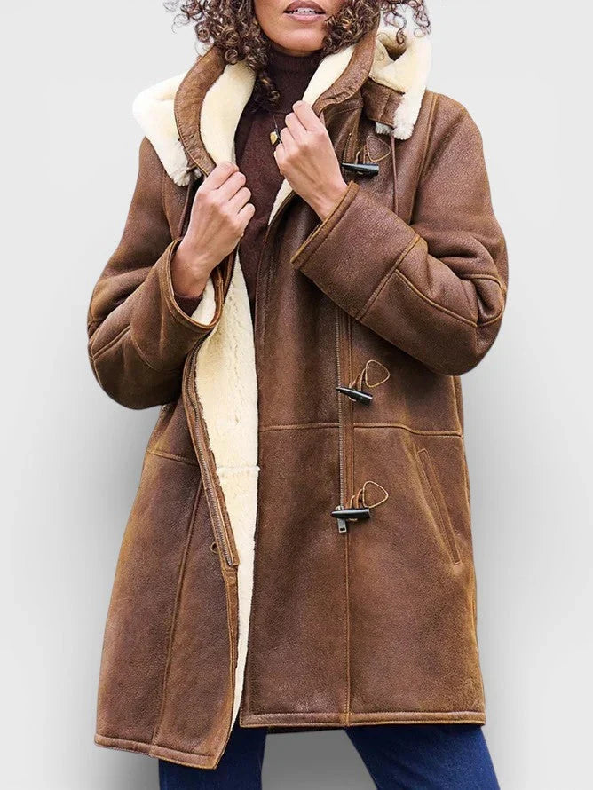 Brown vegan suede duffle coat with cream sherpa lining, toggle fastenings, and a structured, hip-length fit.