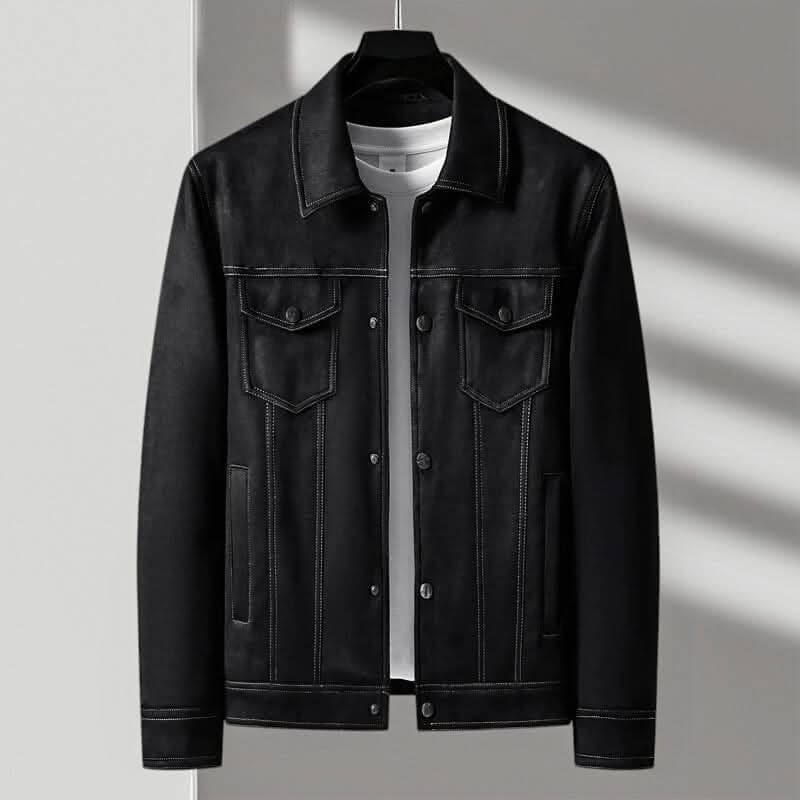 A black suede trucker jacket with a point collar, button-front closure, and boxy fit