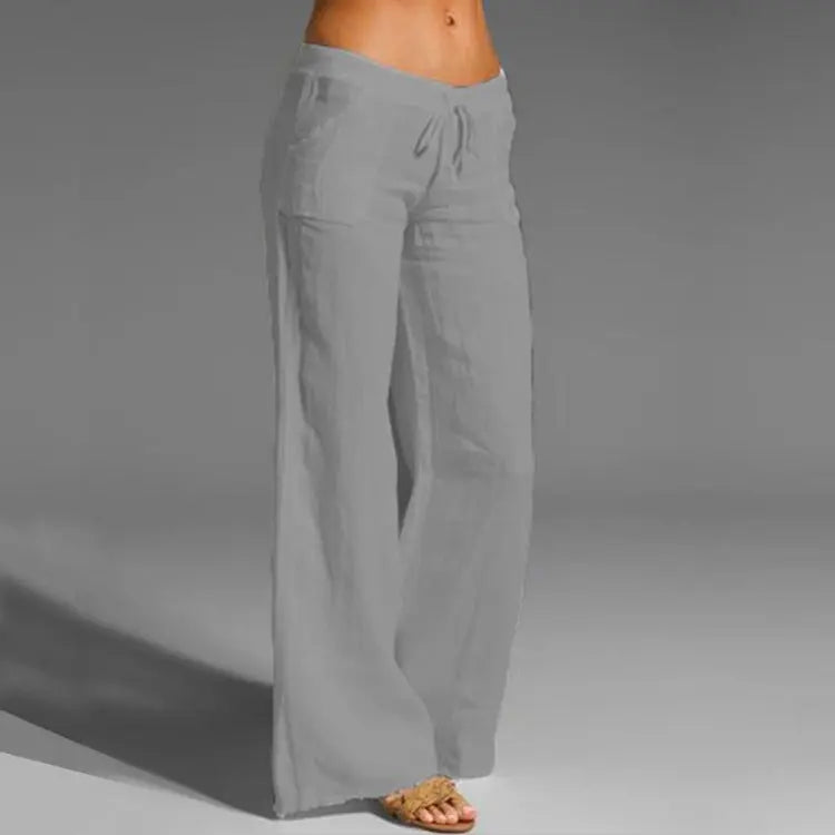 Women's dark gray wide-leg linen pants with a drawstring waistband, loose fit, and flowing wide-leg design.
