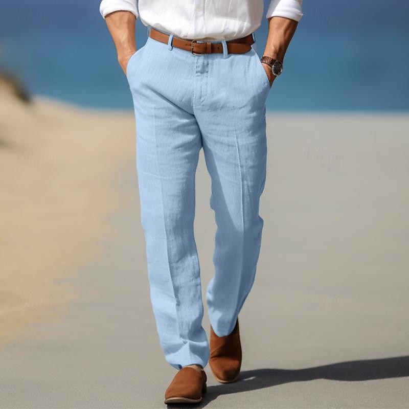 Man wearing light blue linen trousers featuring a straight-leg fit, pleated front, and lightweight breathable fabric.