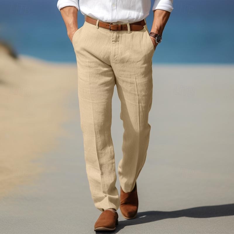 Man wearing beige linen trousers with a relaxed straight-leg silhouette, pleated front, and tailored casual fit.