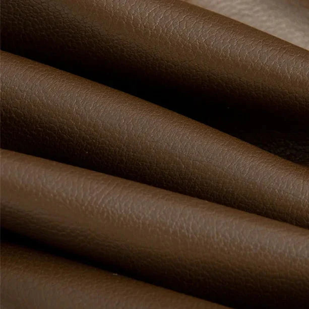 Close-up of the rolled vegan leather material showing its smooth grain and matte finish
