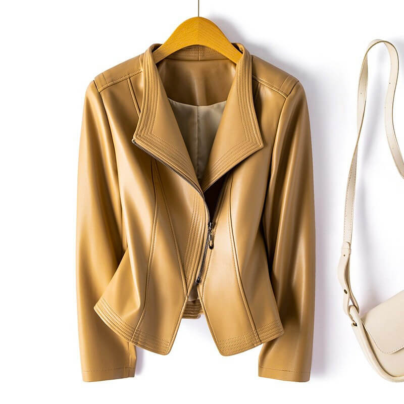 Valeria Vegan Leather Jacket in Warm Beige hanging on display