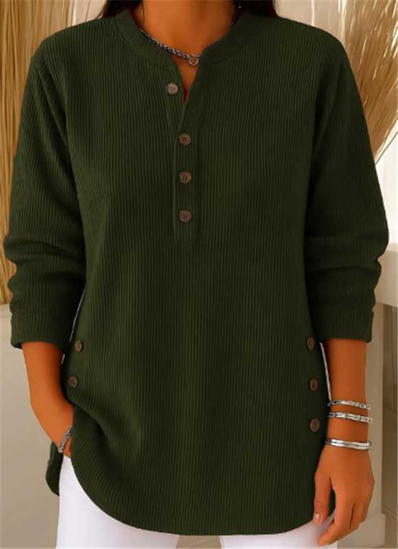 Woman wearing an olive green waffle knit Henley sweater with a split neckline, decorative buttons, long sleeves, and a relaxed silhouette.