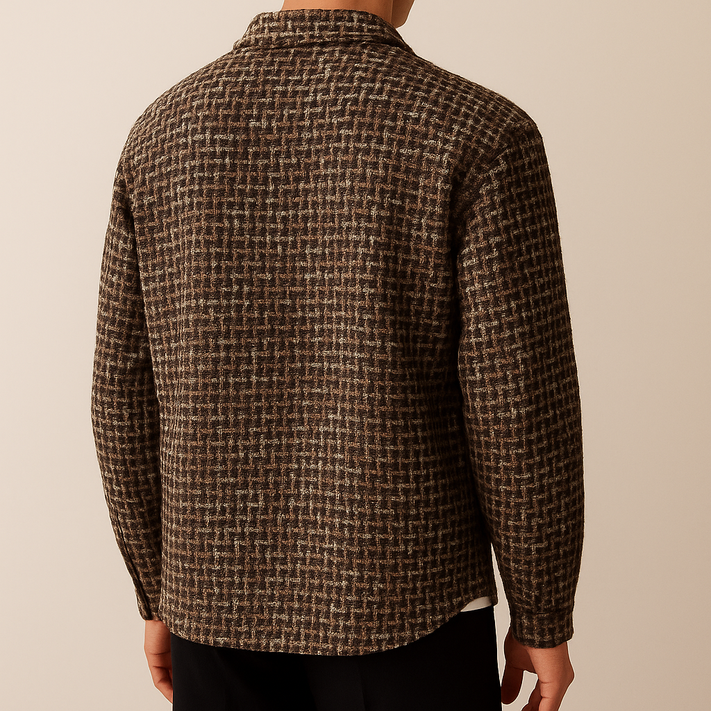 Back view of a man wearing a brown textured plaid overshirt jacket with a relaxed fit and long sleeves.