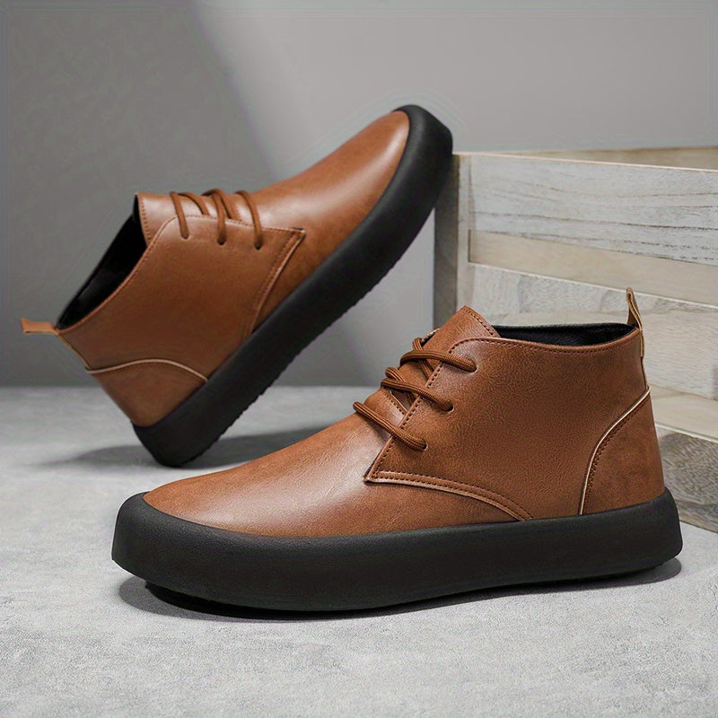 Pair of brown leather chukka-style boots in a dynamic angled pose against wooden crate steps.