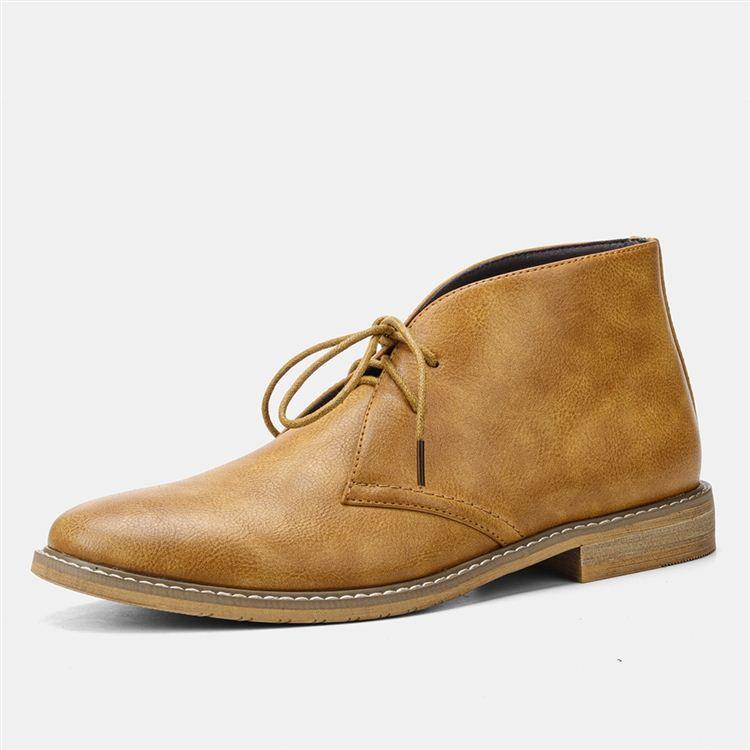 A single tan leather lace-up chukka boot shown in side profile on a plain white background.