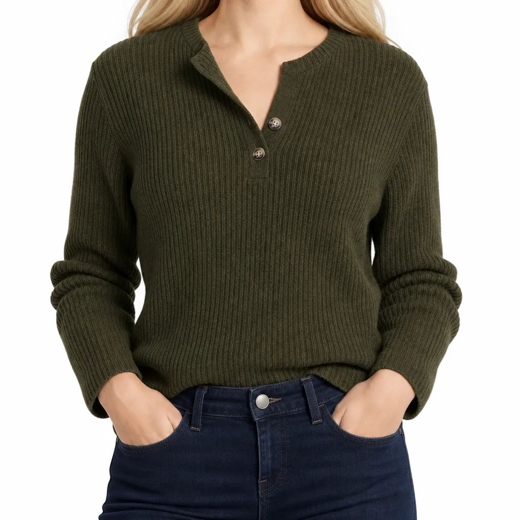 Woman wearing an olive green waffle knit Henley sweater featuring a V-neck button placket, long sleeves, and a relaxed silhouette.