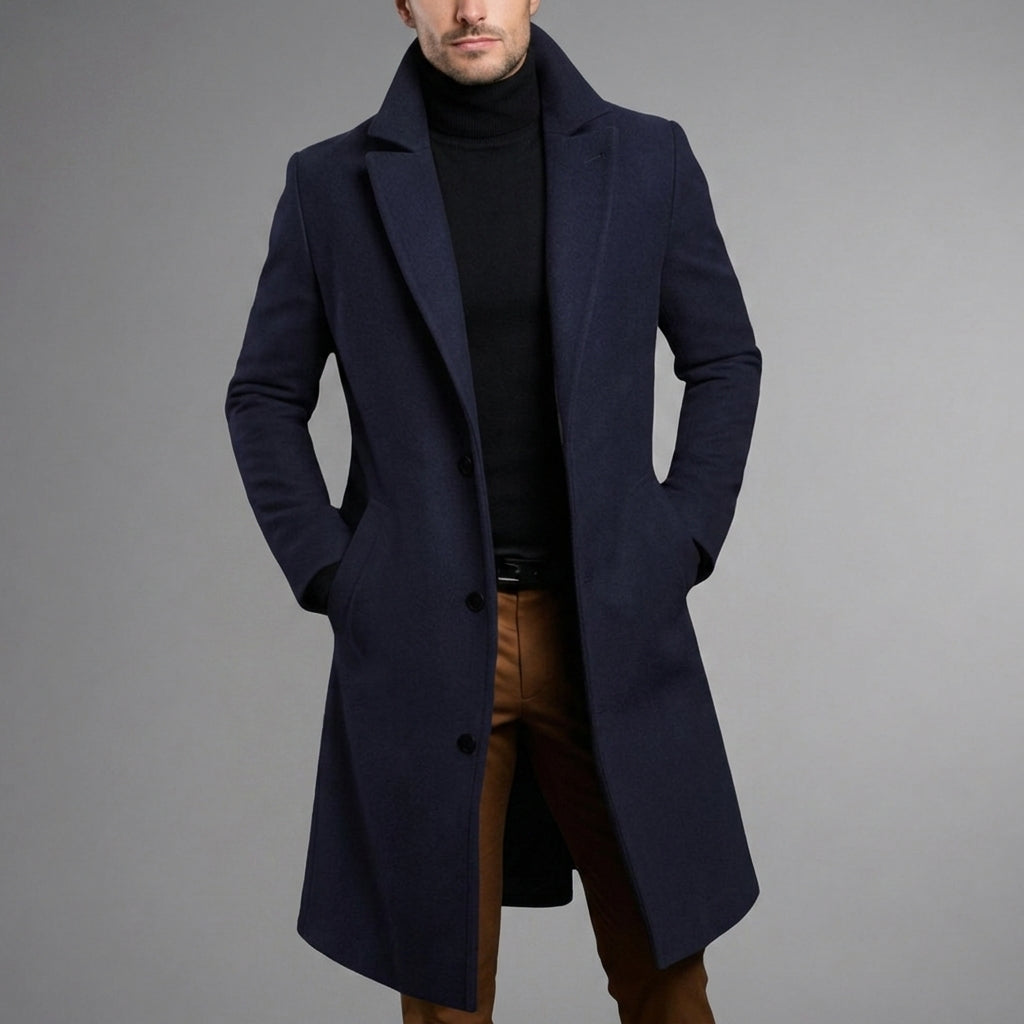 Navy blue wool blend longline overcoat featuring a slim, tailored silhouette and classic button-front closure.
