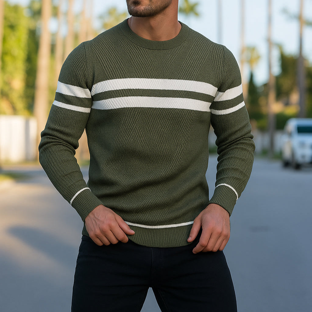Man wearing olive green and white striped crewneck knit sweater outdoors, close-up torso view