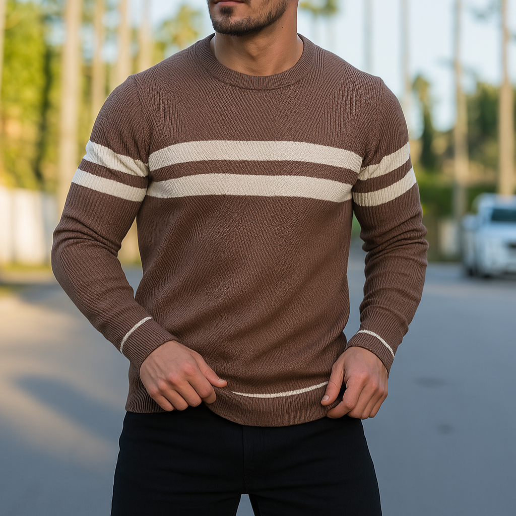 Man wearing brown and white striped crewneck knit sweater outdoors, close-up torso view