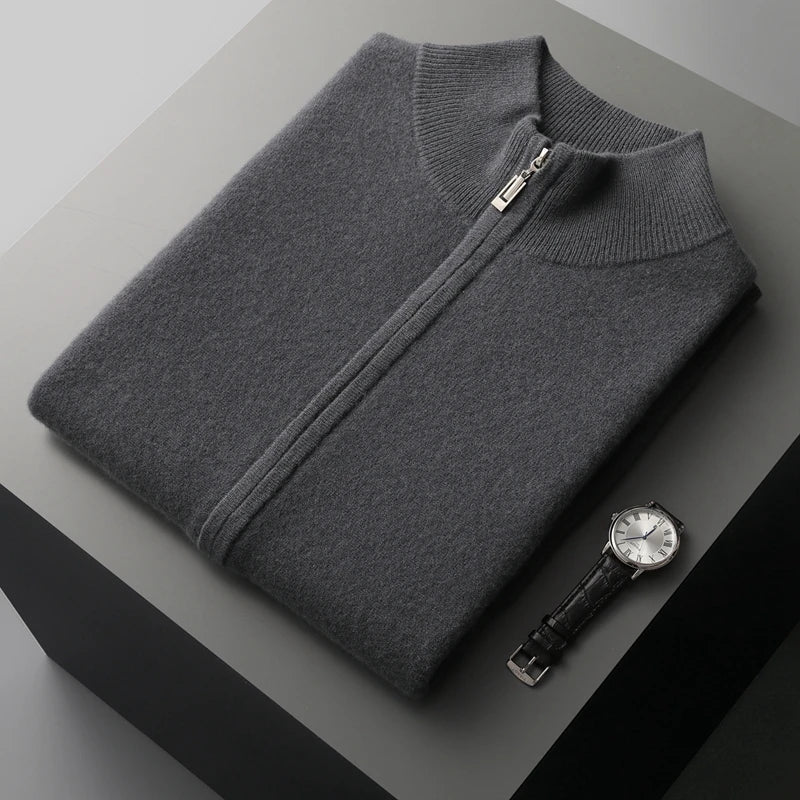 Folded men's charcoal gray zip-up knit sweater vest featuring a stand collar, front zipper, and premium knit fabric.