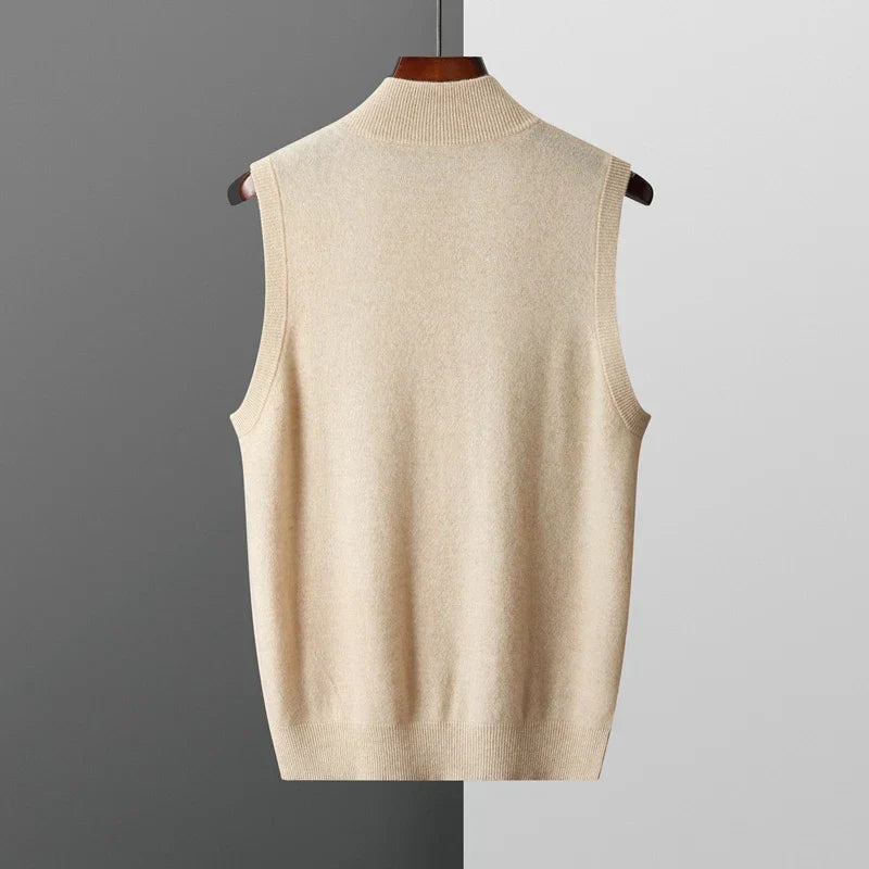 Back view of a men's  light beige sleeveless knit sweater vest with a stand collar and ribbed hem.