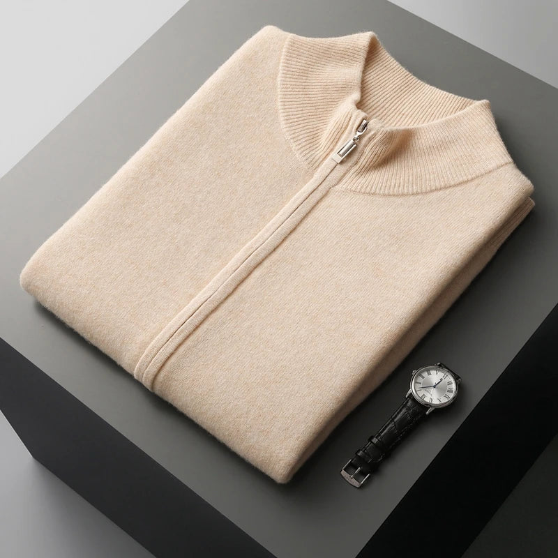 Folded men's light beige zip-up knit sweater vest highlighting the stand collar, zipper closure, and fine knit fabric.